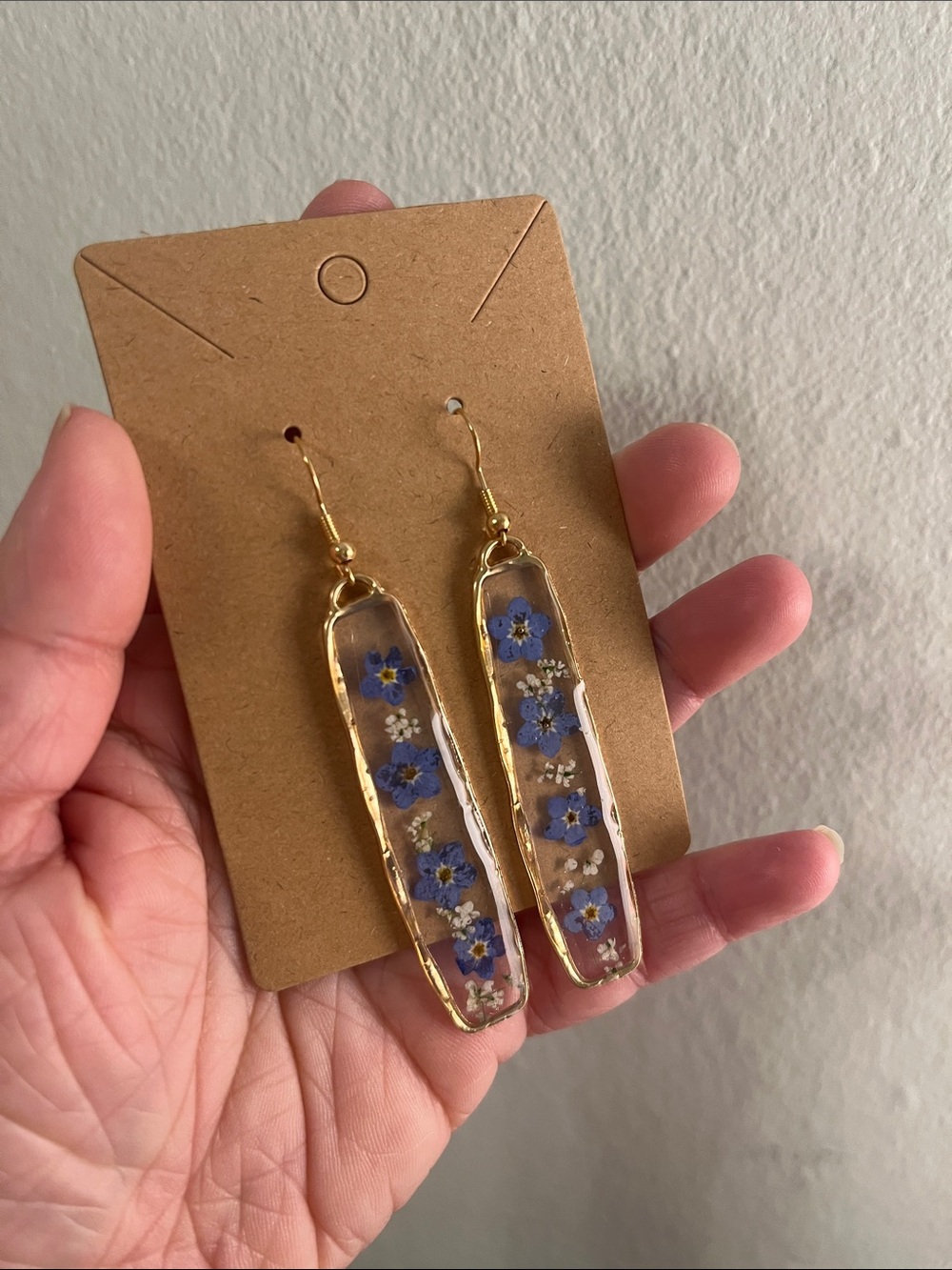Gold Resin Drop Earrings with Blue Flower Inlay
